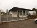 »The entrance / main gate. You'll arrive here. Mainhall is behind that security building.« by